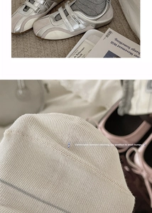 Detailed macro view of seamless toe stitching on striped cotton blend knit socks