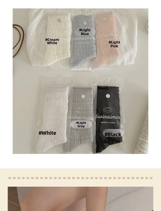 Detailed view of knitted wave texture and diverse pastel colors of cotton crew socks