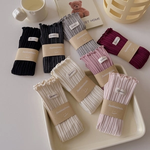 Women's cotton vertical stripe crew socks with ruffle trim in eight various colors