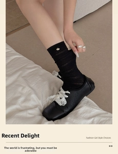 Detail of hollow mesh socks with pearl button and lace bow shoes for a retro girl style