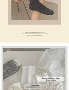 Detail of cotton crew socks featuring cute bear embroidery and decorative ruffle edges