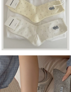 Detail of combed cotton mid-tube socks featuring cute bear embroidery and polka dot patterns