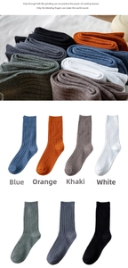 Detail of ribbed knit texture on assorted color cotton crew socks for men