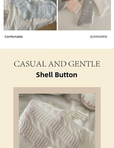 Detail of knit crew socks with shell button accents and textured cable patterns