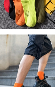 Detail of ribbed crew socks with graphic text in neon colors and premium cotton fabric