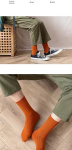 Detailed view of orange ribbed cotton mid-tube socks with soft breathable texture