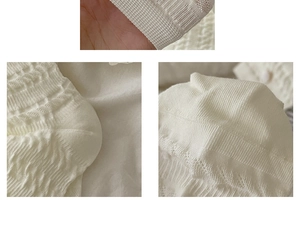 Detail of white hollow knit socks featuring vertical stripes and breathable mesh texture