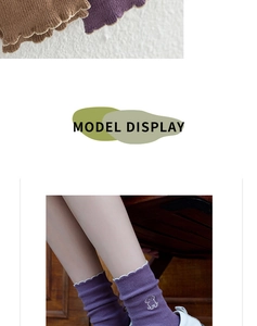 Detail of ruffled edges and cute puppy embroidery on purple cotton knit mid-calf socks