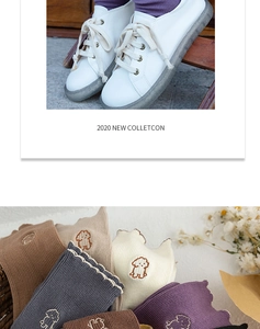 Detail of ribbed cotton socks with cute puppy embroidery and ruffled edges in autumn colors