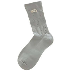 Light blue-grey mid-calf cotton socks with polka dots and an 'I dig you' fabric label