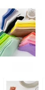 Macro detail of soft cotton knit fabric texture on colorful Morandi mid-calf socks