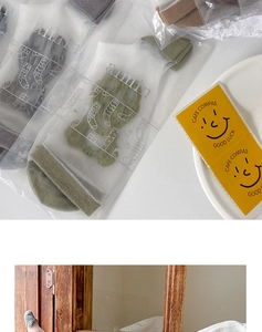 Detail of sheer Lolita mesh socks in various colors with individual brand packaging