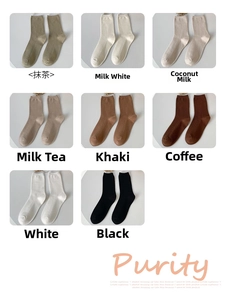 Detailed close-up of textured cotton ribbed socks in eight earthy color options