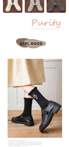 Close-up of frilly edge ankle socks with delicate floral embroidery and ribbed texture