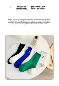 Detailed view of mid-calf cotton socks with embroidered C logo in various colors