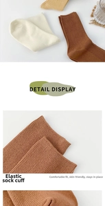 Close-up of elastic ribbed cuffs on cotton blend socks in earthy Morandi colors