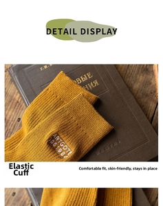 Close-up of ginger yellow ribbed cotton crew socks with white letter embroidery