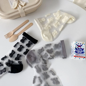 Three pairs of sheer mesh crew socks with 3D flocking bear patterns in black, white and grey
