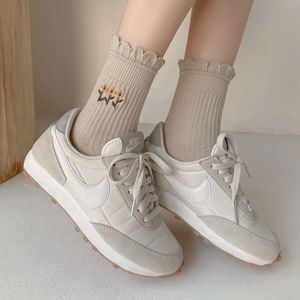 Retro cream beige sneakers with floral embroidered ruffled socks in minimalist style