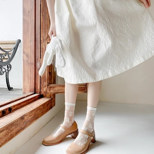 Sheer white bear pattern crew socks paired with Mary Jane shoes for a cute aesthetic