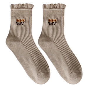 Beige knit cotton socks with frilly cuffs and floral embroidery in retro Japanese style