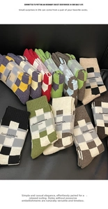 Macro detail of checkered wool socks showing premium knitted texture and ribbed cuffs