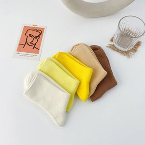 Five pairs of Morandi rainbow crew socks in warm tones with ribbed cotton texture