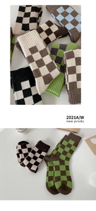 Close-up of thick knitted wool socks with checkerboard pattern for winter warmth