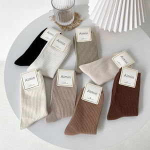 Assorted waffle knit combed cotton crew socks for women in minimalist earth tones