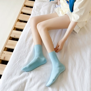 Classic light blue vertical striped mid-calf cotton socks in a soft home setting
