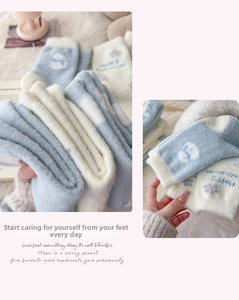 Detail of blue snowman coral fleece socks with warm turnover cuff and thick winter texture