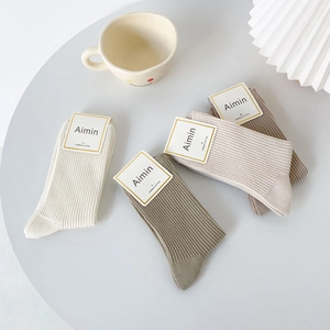 Set of four combed cotton ribbed crew socks in earth tones like khaki and olive green