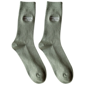 Green cotton mid-calf socks with white ribbed texture and minimalist letter embroidery