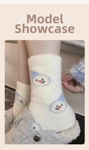 Detail of plush winter sock with blue hat snowman pattern and soft fleece texture