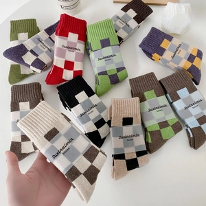 Thick wool checkered crew socks in various retro color patterns for winter warmth