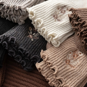 Women's vintage wool socks with ruffled edges and delicate floral embroidery details