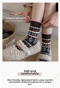 Detail of vintage brown wool socks with floral pattern and pink scalloped cuffs
