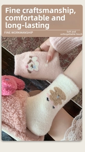 Detail of pink puppy embroidery on thick warm coral fleece socks for women