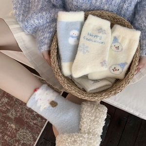 Blue snowman pattern winter thermal socks made of thick plush coral fleece for warmth