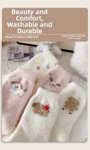 Detail of soft pink and white fuzzy puppy socks with cute red bows and lace trim