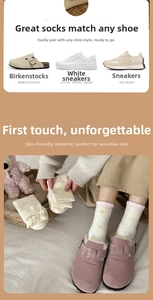 Detail of warm fluffy socks with colorful polka dots and elegant pink ruffled edges
