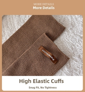 Detail of dark brown knit sock cuff with a SUSTAINABLE leather patch on ribbed fabric