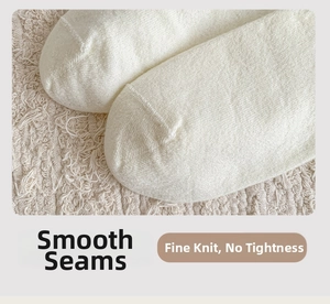 Detail of flat seam toe and fine knit texture on soft cream wool socks for women
