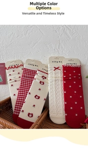 Detail of red and white floral, plaid, and cat patterned cotton mid-calf socks set