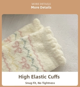 Detail of elastic ribbed cuff on thick beige socks with pink bow and rainbow wave