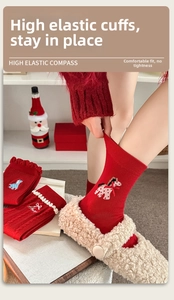 Detail of red crew socks featuring cute cartoon horse embroidery and sweet bow accents