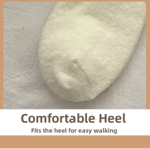 Close-up of fluffy thick oatmeal thermal socks focusing on the cozy heel and fuzzy texture