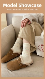 Close-up of cozy brown suede mule slippers with warm plush lining and knit socks