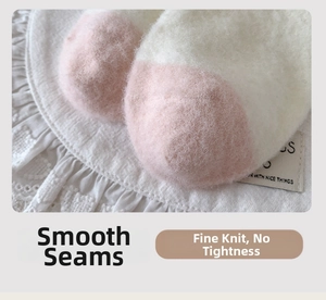 Detail of flat seam toe construction on plush pink and beige cartoon winter socks