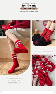 Detail of red crew socks featuring pearl accents and embroidered festive dog patterns
